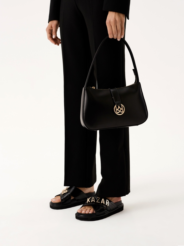 Mules in pelle nera con scritte in metallo DESIRE